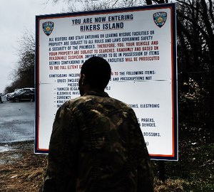 In this 2017 file image, an unidentified man enters the road to Rikers Island in New York City. (Photo/Spencer Platt with Getty Images via TNS)