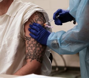 An incarcerated individual at the Bolivar County Correctional Facility in Mississippi receives a covid-19 vaccination in April 2021.