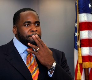 In this photo from Sept. 4, 2008, then Detroit Mayor Kwame Kilpatrick reads a statement at his office in Detroit.