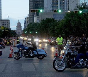 Bikers parade down Congress Avenue on Friday night to kick off the 2019 Republic of Texas Biker Rally.(Photo/ Tribune News Service)