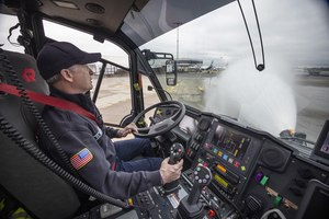 Jay Williams, a driver/engineer with the Port of Seattle fire department, sprays water from the Aircraft Rescue Firefighting Vehicle he is driving at Seattle-Tacoma International Airport in SeaTac on Thursday, Jan. 19, 2023. The vehicles can pump out 600 gallons a minute at low flow and 1200 gallons at high flow.