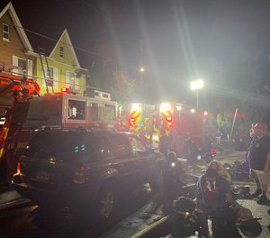 One firefighter was injured in a blaze that spread to four attached homes in Harrisburg, Pa. on July 4.