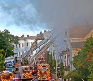 Smoke pours from 63 Harrison St. in Worcester on Thursday. (Photo/Tribune News Service by T&G Staff, Steve Lanava)
