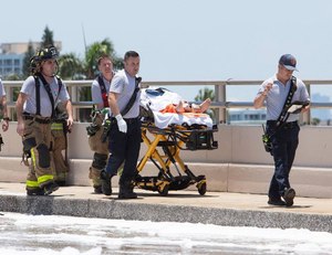 Miami-Dade Fire Rescue crewmembers transported an injured patient after a plane hit the Haulover Inlet Bridge on Saturday.
