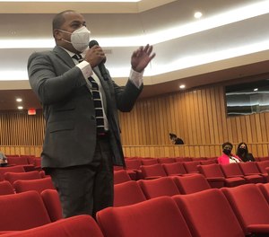 Miami-Dade Commissioner Keon Hardemon speaks from the second row of the commission chambers on Tuesday, Oct. 19, 2021, to demonstrate how far away citizens would need to stand back from police under state legislation the board was asked to endorse.