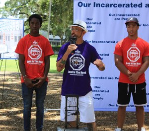 Ruben Saldaña, a formerly incarcerated person who now serves as a mentor to Orlando-area children, speaks at a rally about prison reform at Lake Eola Park in Orlando, Florida, on Saturday, July 23, 2022. (Amanda Rabines/Orlando Sentinel/TNS)