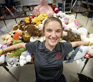Hannah Jenkins, a senior at Bartow High School’s Medical and Fire Academy, has collected nearly 200 stuffed animals at the school to comfort children enduring a traumatic situation. (Photo/Ernst Peters, The Ledger)