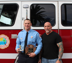 Daytona Beach firefighter James Axiotis, left, is shown with Officer Sean Walker three weeks after Walker’s heart attack.