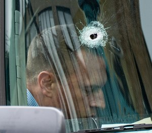 A bullet hole in the windshield of an Amazon vehicle after a shooting incident in Brooklyn, New York.