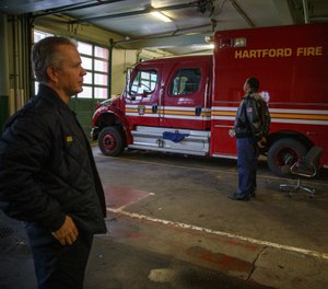 Hartford Fire Assistant Chief Dan Reilly, left, and retired Hartford Fire Chief Charles Teale stand in the former Hartford Fire Department headquarters on Pearl Street. (Photo/Mark Mirko, Hartford Courant)