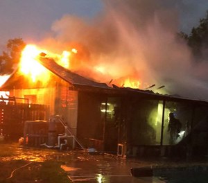 Firefighters rescued a woman who became overcome with smoke after re-entering a burning home near Valrico to retrieve her medication on May 27, 2019. (Photo/Hillsborough County Fire Rescue)