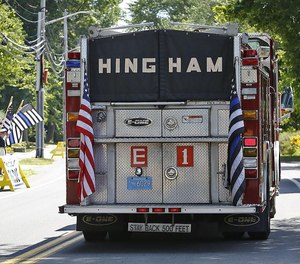 A Hingham fire truck flying the “thin blue line