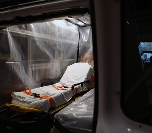 A ambulance that has been wrapped in plastic sheeting for transporting COVID-19 patients is pictured inside the Upper Merion Fire and EMS station in King of Prussia, Pa. The U.S. House of Representatives on Monday adopted legislation to ensure that families of first responders who are disabled or die from the virus get Public Safety Officers Benefit program payments. (Photo/Tim Tai, The Plain Dealer)