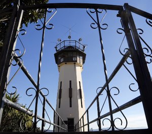 Correctional officers in Tower One keep watch during a media tour at San Quentin prison.