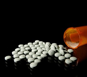 OxyContin 80 mg pills in an August 2013 file image. A federal appeals court has upheld the conviction of a former Hazard doctor and his wife accused of improperly prescribing pain pills. (Liz O. Baylen/Los Angeles Times/TNS)