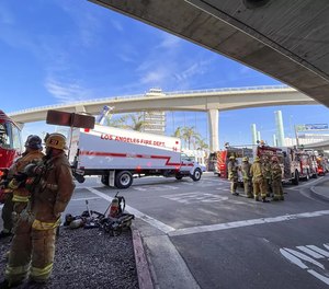 First responders investigate the scene at Los Angeles International Airport where a carbon dioxide leak left four people sick Monday.
