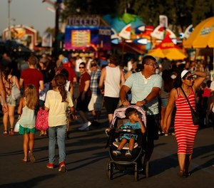 Crowds make their way through the expansive grounds at the Los Angeles County Fair in Pomona, Calif. on Sept. 23, 2015.