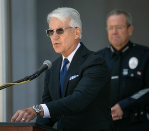 Los Angeles County District Attorney George Gascon, left, and L.A. Police Chief Michel Moore, along with community leaders, discuss community violence reduction efforts last year in Los Angeles.