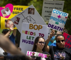 Family members of people incarcerated in Texas prisons demonstrate on the southwest lawn of the Capitol to draw attention to the growing COVID-19 crisis in state prisons.