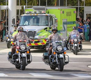 Police escort the body of Miami-Dade Police Detective Cesar Echaverry from Jackson Memorial Hospital to the Miami-Dade County Medical Examiner’s Department on Friday, Aug. 19, 2022.