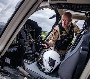 Lt. Craig Benz shows off the State Patrol helicopter, a $12 million Bell 407 used to assist law enforcement on the ground during special enforcements, on Tuesday, May 9, 2023, in St. Paul, Minnesota.
