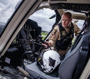 Lt. Craig Benz shows off the State Patrol helicopter, a $12 million Bell 407 used to assist law enforcement on the ground during special enforcements, on Tuesday, May 9, 2023, in St. Paul, Minnesota.