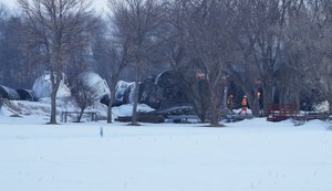 A BNSF train carrying ethanol and corn syrup derailed and caught fire in the west-central Minnesota town of Raymond early Thursday.