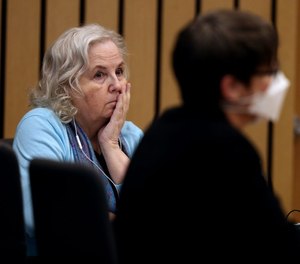 Nancy Crampton Brophy (left), accused of killing her husband Dan Brophy in June 2018,  listens at her murder trial on May 25, 2022.
