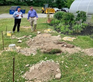 Assistant Deputy Superintendent Steve Randall, left, and Sheriff Jerry McDermott, right, at the proposed gardening site.