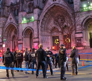 Police respond after a shooting incident outside the Cathedral of Saint John the Divine on West 112th Street and Amsterdam Avenue in Manhattan, New York City on Sunday, December 13, 2020.