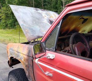 A pickup caught fire along U.S. Route 30 west of state Route 241 Monday afternoon. An off-duty firefighter, who happened to be driving a truck hauling water, doused the flames before firefighters arrived.