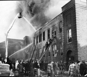 Firefighters fight the blaze at Our Lady of the Angels grade school Dec. 1, 1958. This photo was taken as the fire roared through the school, which formerly was the parish church, and before the enormous loss of life was apparent.