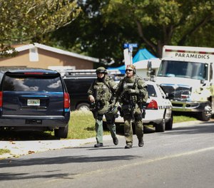 Pinellas Park SWAT officers leave a shooting in 2019. A state law now gives authority to sheriffs and police chief to train SWAT medics to carry firearms in high-risk situations. Police agencies across the Bay Area are training SWAT medics to carry the weapons. The law does not allow them to carry firearms for routine calls.