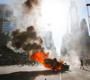 Smoke rises from Philadelphia Police cruiser in Center City during the Justice for George Floyd Philadelphia Protest on May 30, 2020.