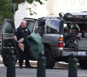 Members of U.S. Capitol Police investigate a suspicious vehicle outside the U.S. Supreme Court on Tuesday, Oct. 5, 2021, on Capitol Hill in Washington, D.C.