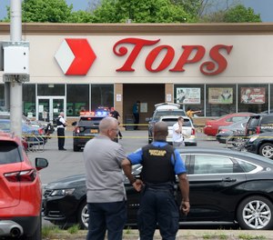 Police on scene at a Tops Friendly Market on Saturday, May 14, 2022, in Buffalo, New York. Ten people were killed after a mass shooting at the store.