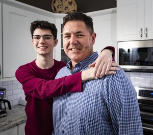 Andy Taylor, a cardiac arrest survivor, with his son Caleb Taylor. Caleb, then 14, helped save his father's life after taking a CPR course at his middle school.