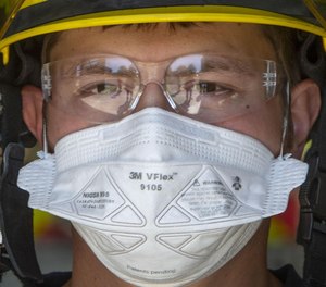Eugene Springfield Firefighter-Paramedic Joey Parsons wears a mask in this April 2020 photo.