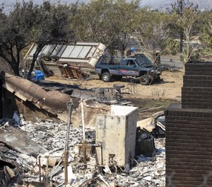 The remains of a burned home as the Bobcat fire continues to burn in the Angeles National Forest in Juniper Hills Sunday, Sept. 20, 2020. Retired U.S. Forest Service Fire Chief Tom Harbour says he believes fire seasons will only worsen if wildland management strategies do not change.