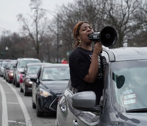 Ana McCullom and a coalition of activists from across the Chicago area protest in a caravan of vehicles to slow traffic on S. California outside the Cook County Jail calling for the mass release of incarcerated people in the state of Illinois to prevent the further spread of COVID-19.