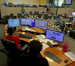 Operators answer emergency calls at a Broward County 911 dispatch center in July 2015. Many patients with nonemergency concerns call 911 because they don’t see an obvious alternatives, said Dr. Peter Tanghe. (Photo/TSN)
