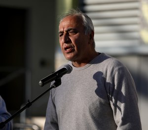 Hamid Khan, seen here at a February news conference to oppose the reappointment of LAPD police Chief Michel Moore, is an organizer with the Stop LAPD Spying Coalition, which has launched a searchable online database of LAPD officers, Watch the Watchers.