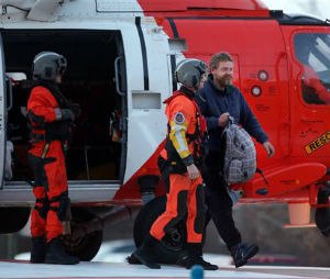 Louis Jordan, right, walks from the Coast Guard helicopter to the Sentara Norfolk General Hospital in Norfolk, Va., after being found off the North Carolina coast, Thursday, April 2, 2015. His family says he sailed out of a marina in Conway, South Carolina, on Jan. 23, and hadn't been heard from since. (AP Photo/The Virginian-Pilot, Steve Earley)