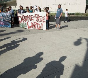 Protestors show their opposition to the LAPD getting drones on Aug. 8, 2017 in Los Angeles.