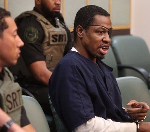 Markeith Loyd, right, accused of killing Orlando Police Lt. Debra Clayton as well as his pregnant ex-girfriend, converses with Orange-Osceola Chief Judge Frederick Lauten Wednesday, March 1, 2017 in Orlando, Fla. (Red Huber/Orlando Sentinel/TNS)