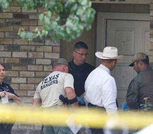 Plano police and the Texas Rangers work the scene of a shooting at a home in the 1700 block of West Spring Creek Parkway in Plano, Texas, on September 11, 2017.