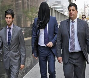 In this Tuesday, May 19, 2015 file photo, Wojciech Braszczok, center, is led into the court in New York. (AP Photo)