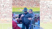 Deputy carries girl he saw struggling up 30 rows to her seat at football game