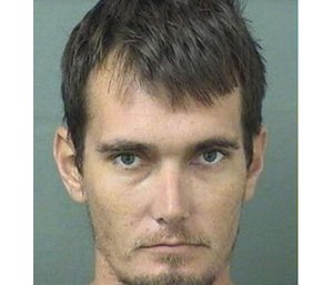 Christopher Hartley, 33, was arrested Tuesday on a child-neglect charge. (Photo/PBCSO)