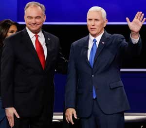 Tim Kaine (left) and Mike Pence shake hands after a contentious debate.